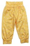 Žlutooranžové ľahké nohavice s kvietkami